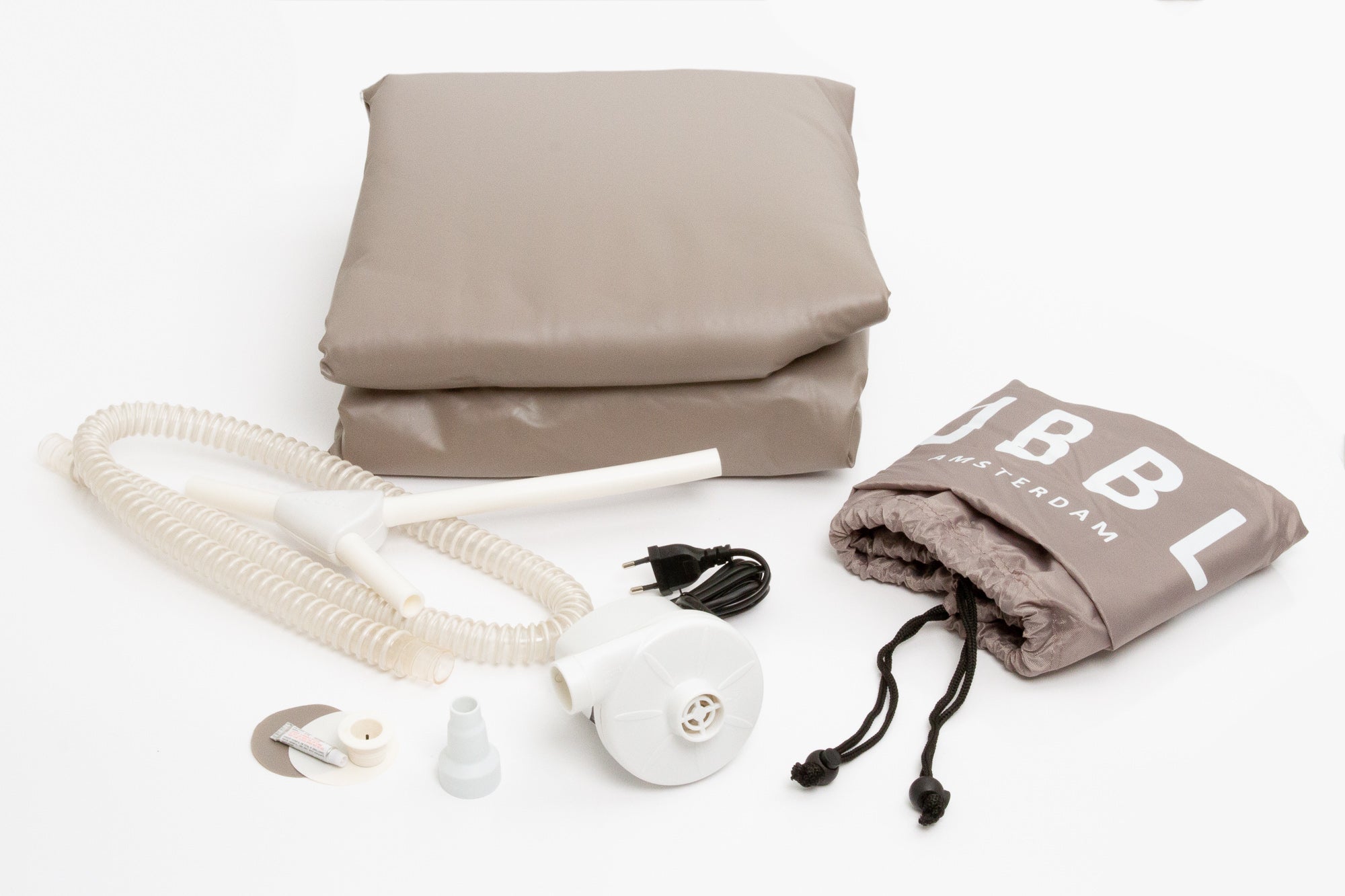 Hypnotherapy relaxation kit with pillow, hose, and bag on white background