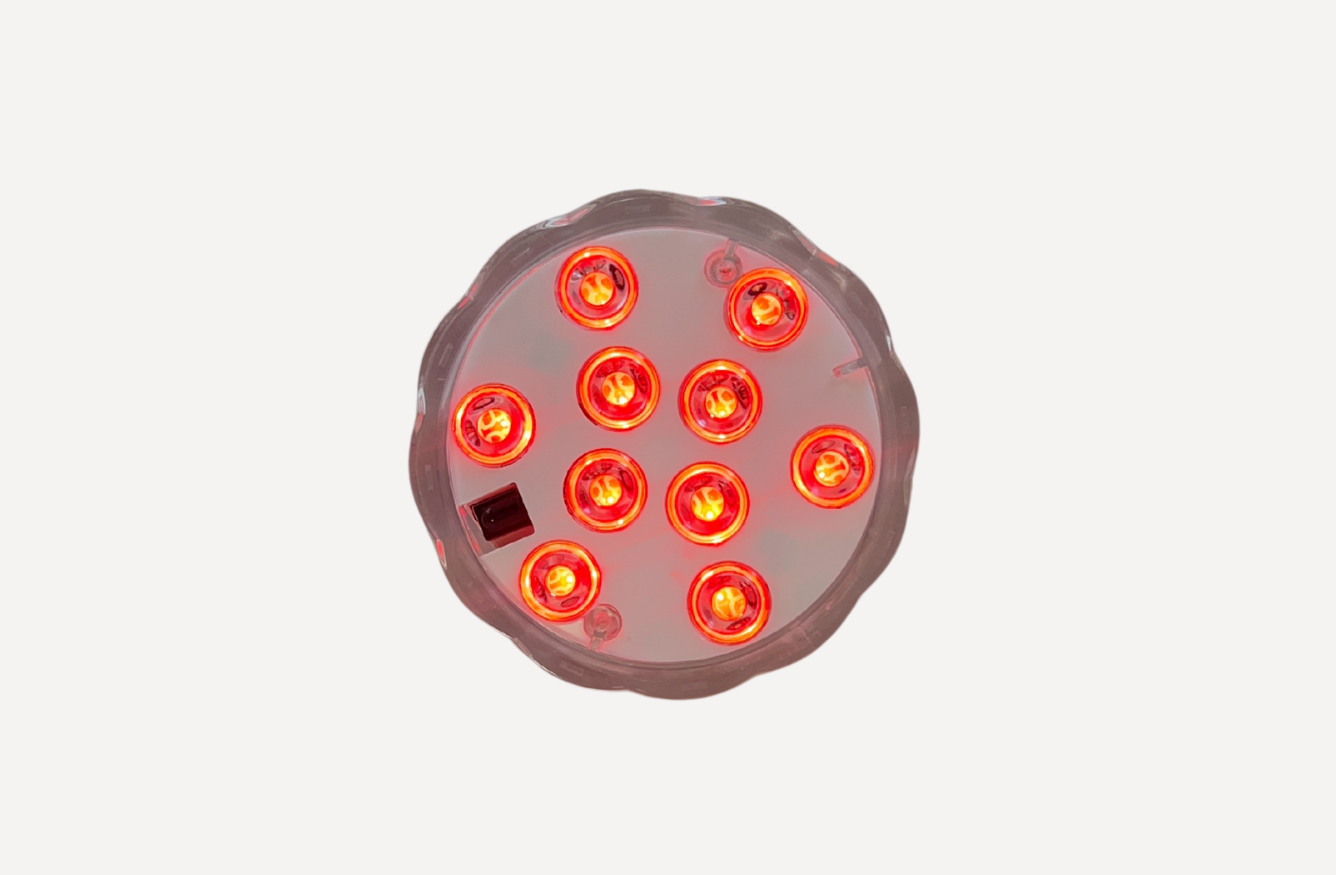 Top view of orange submersible LED spa light for Tubble bathtubs.