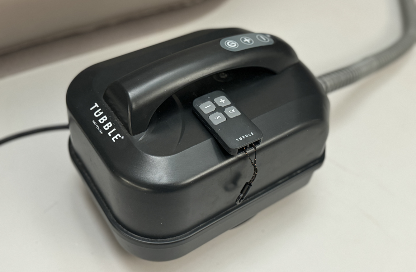 Tubble inflatable bath pump with attached control remote.