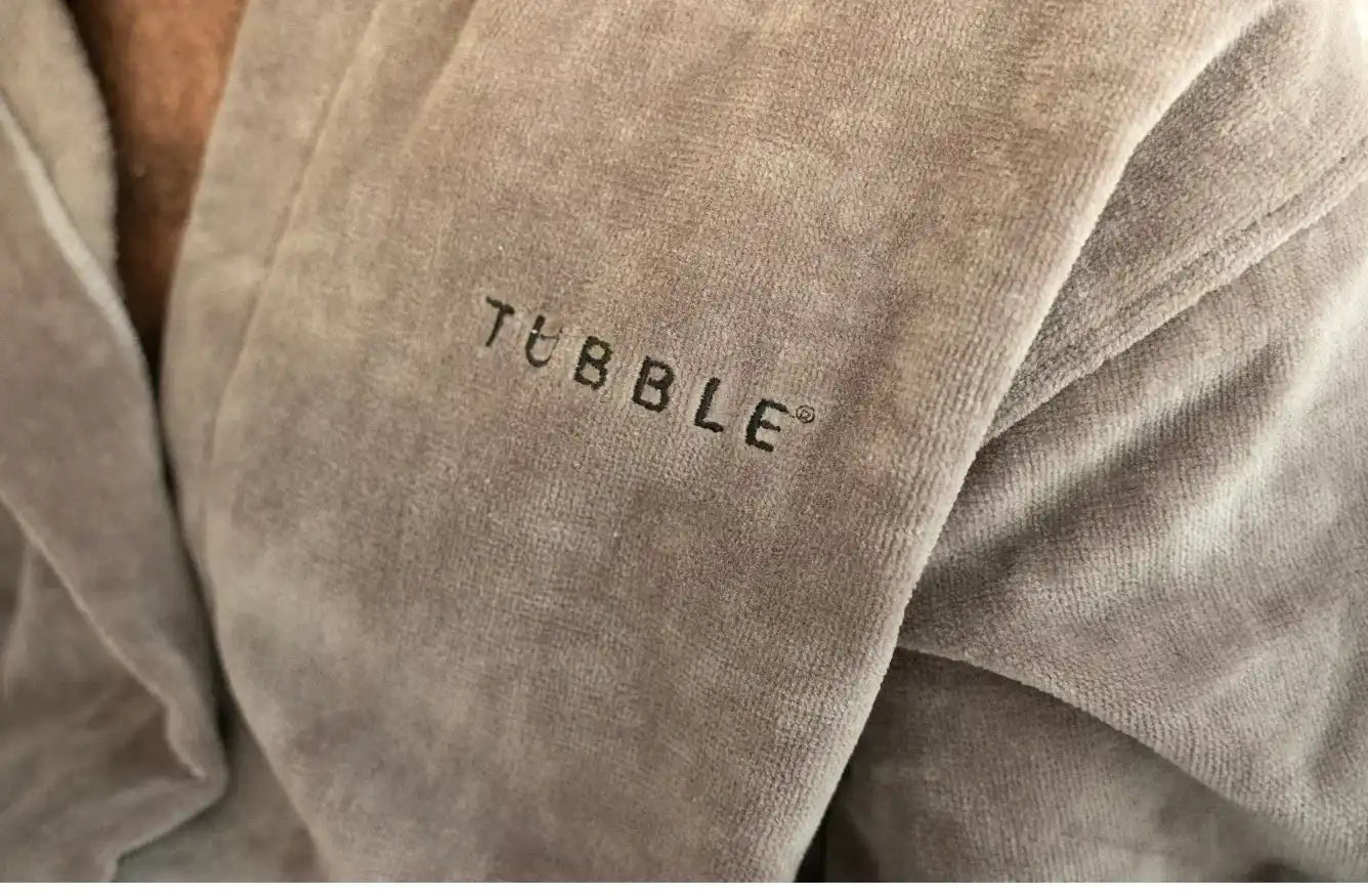 Close-up of a brown textured fabric with 'Tubble' branding.